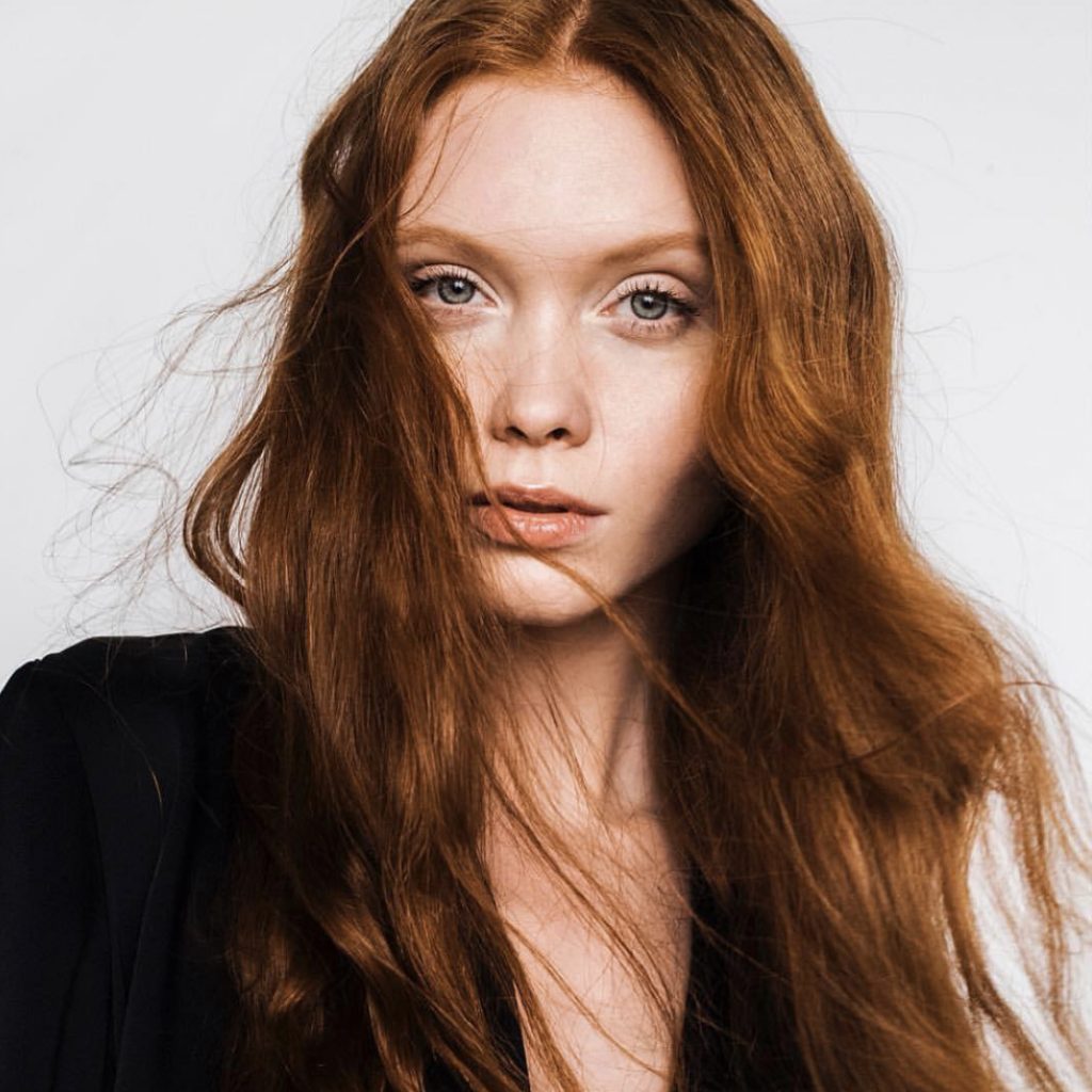 Red head model with clean skin makeup